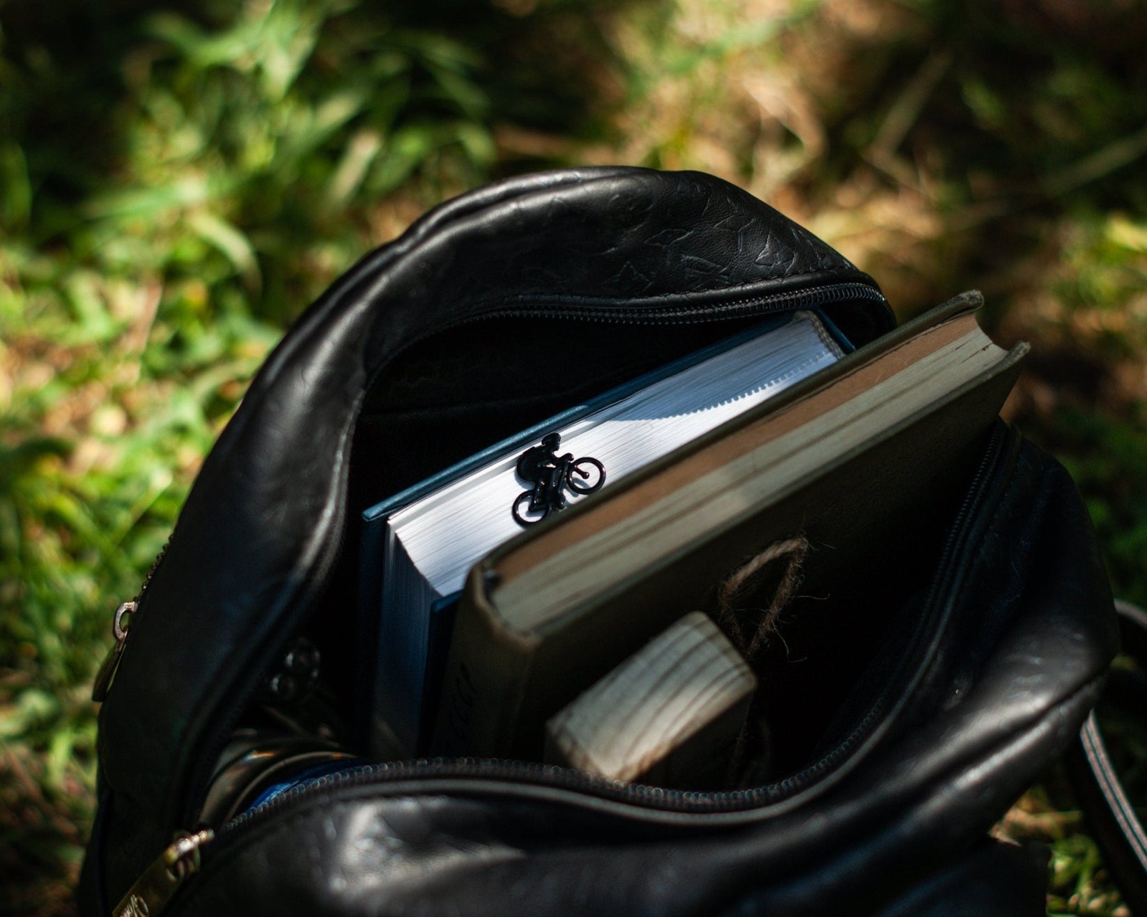 Bike Racing metal bookmark — on a bike bag outdoors