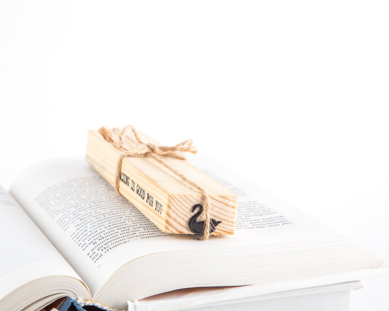 Black Swan metal bookmark with the engraved wooden gift block it ships with