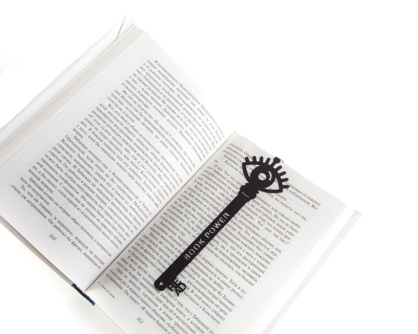 Book Power Is the Key metal bookmark resting on the pages of an open book
