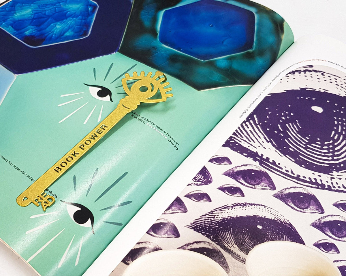 Book Power Is the Key metal bookmark in gold placed on a colour illustration, view 6