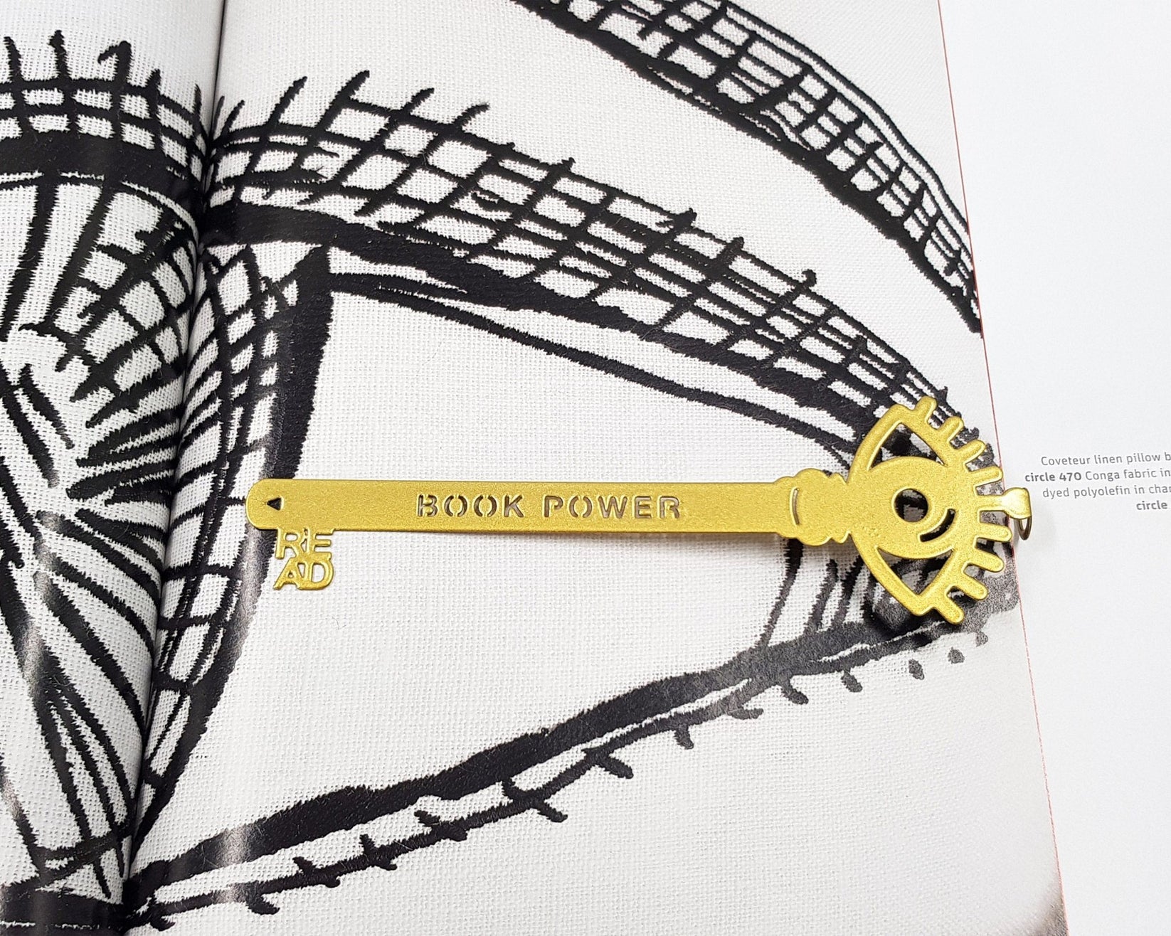Book Power Is the Key metal bookmark on an illustrated page, view 5