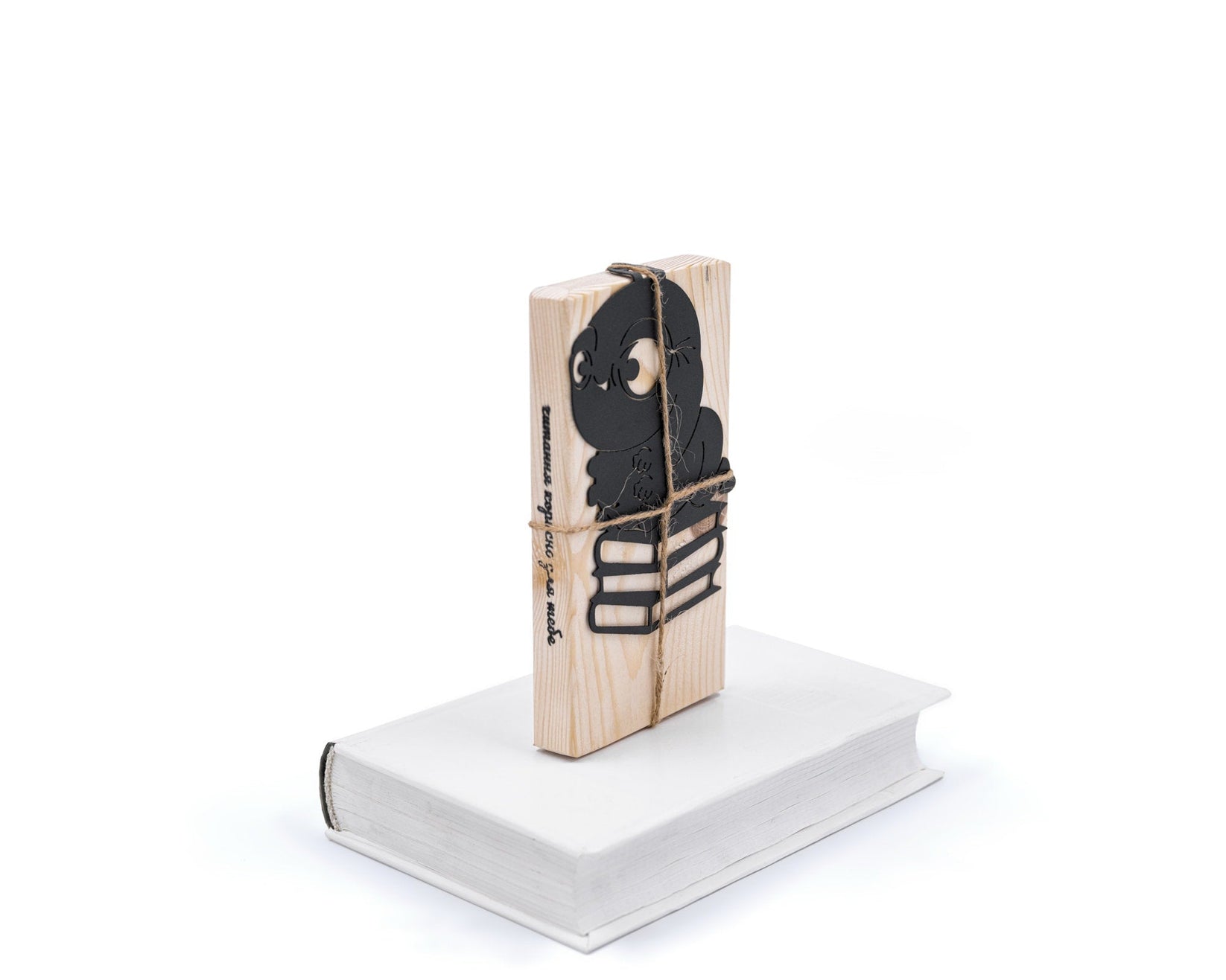 Bookworm metal bookmark in green shown with its wooden gift block