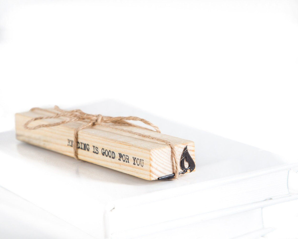 Burning Lucifer Match metal bookmark with the engraved wooden gift block it ships with