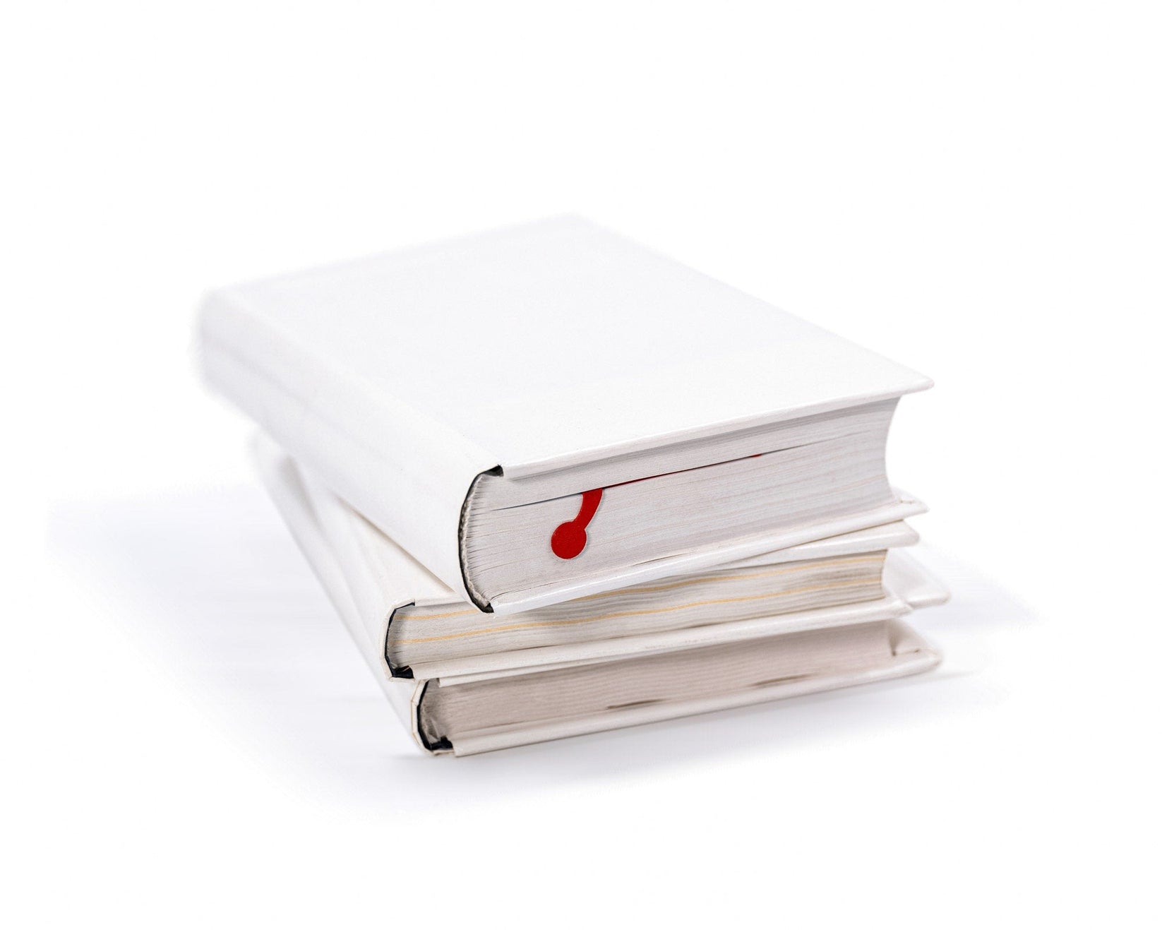 Charming Centipede metal bookmark in red on a pile of books
