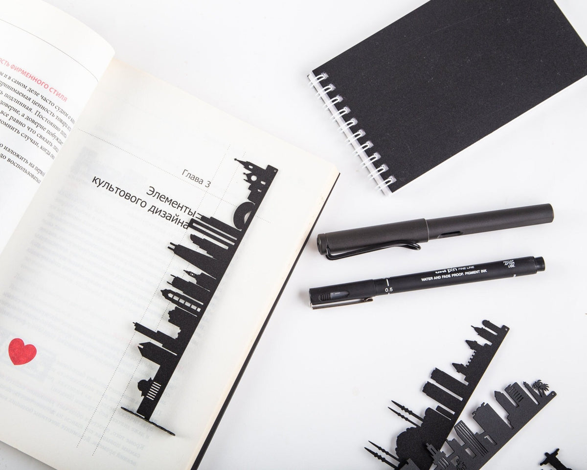 Chicago metal bookmark marking a page in a notebook