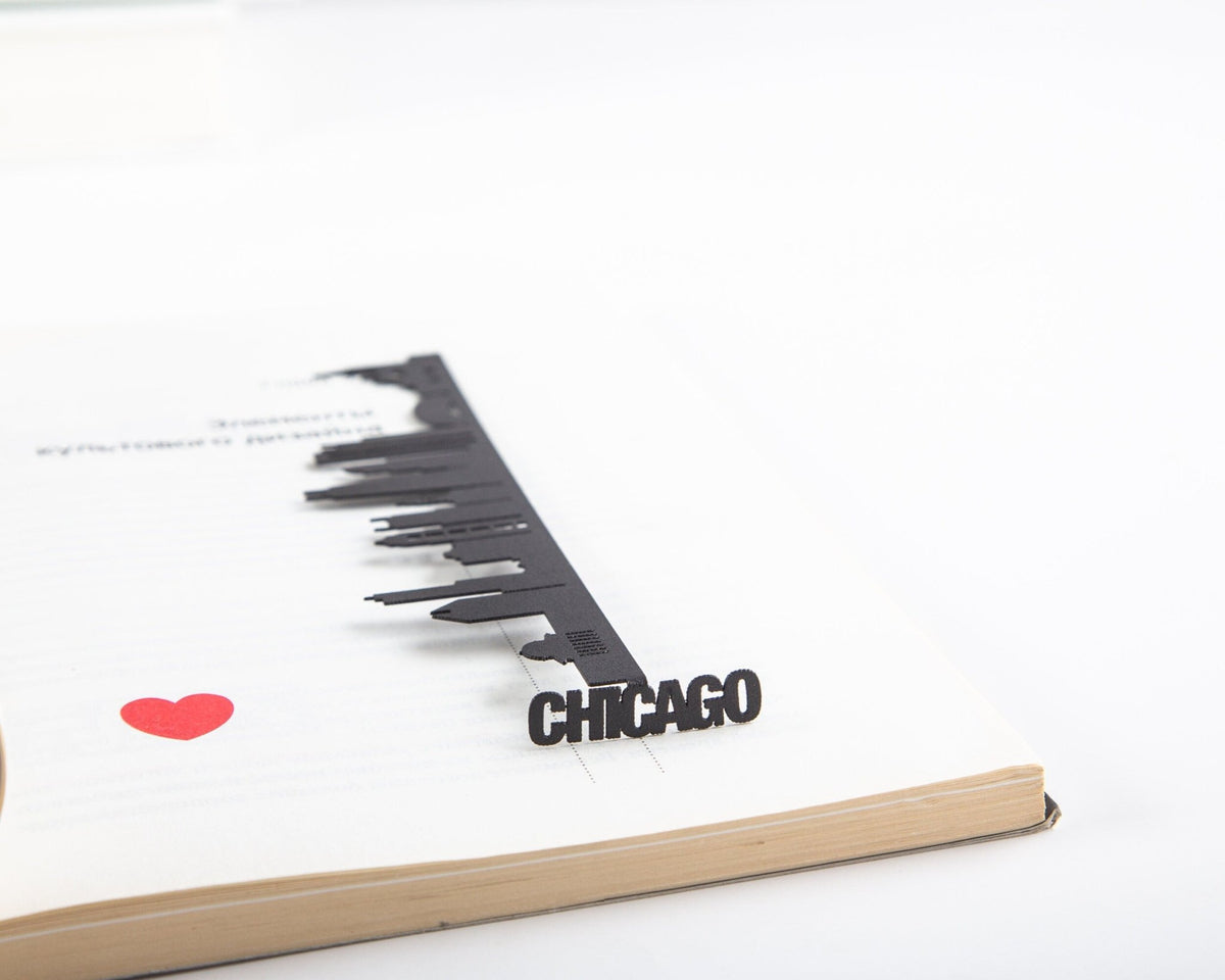 Chicago metal bookmark resting on the pages of an open book