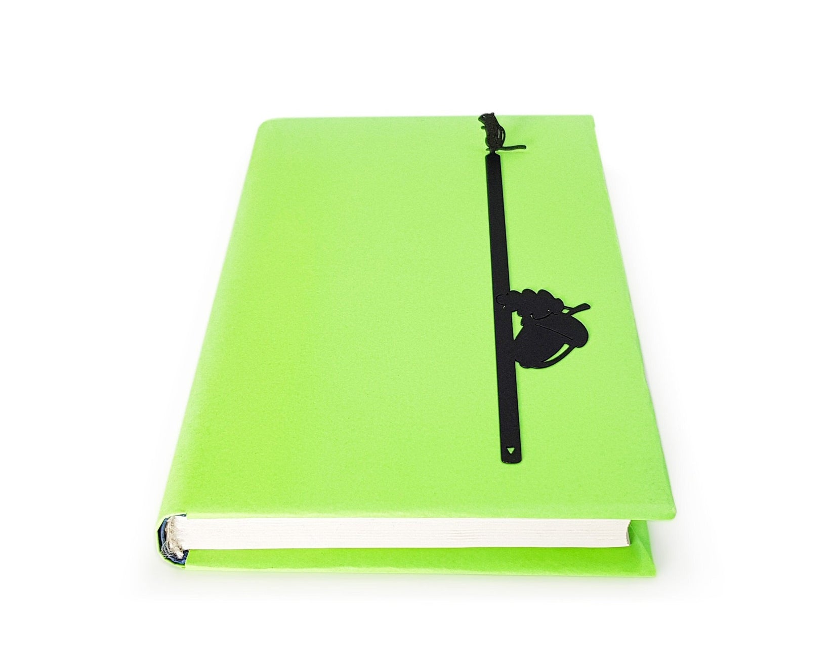 Chipmunk and the Acorn metal bookmark marking a page in a notebook