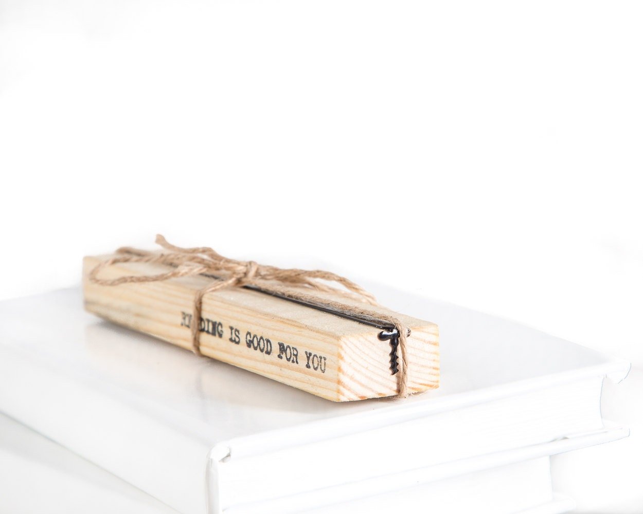 Corkscrew metal bookmark with the engraved wooden gift block it ships with