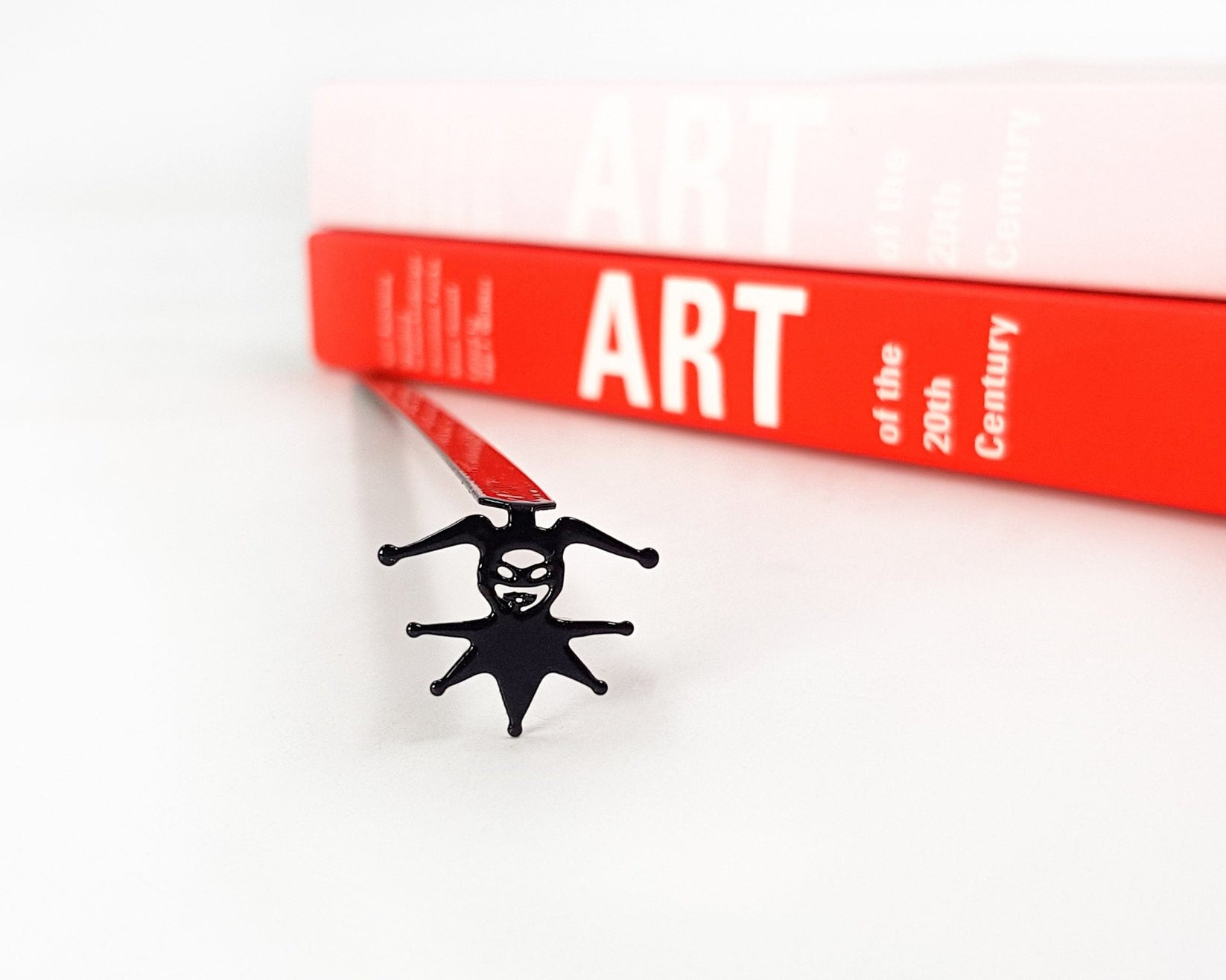 Court Jester metal bookmark on a coloured background