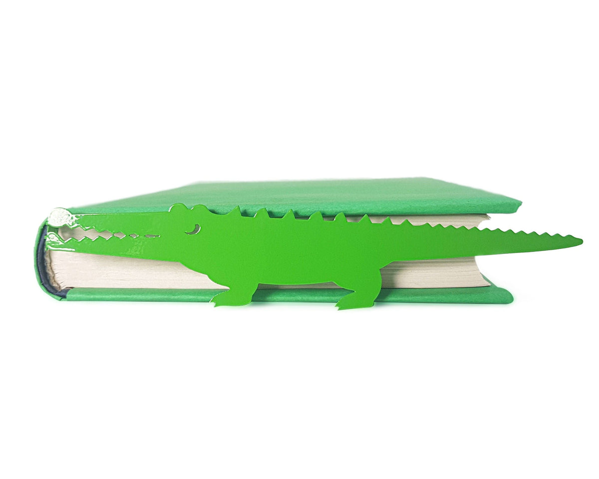 Crocodile and the Nile Bird metal bookmark in green shown flat on a white background