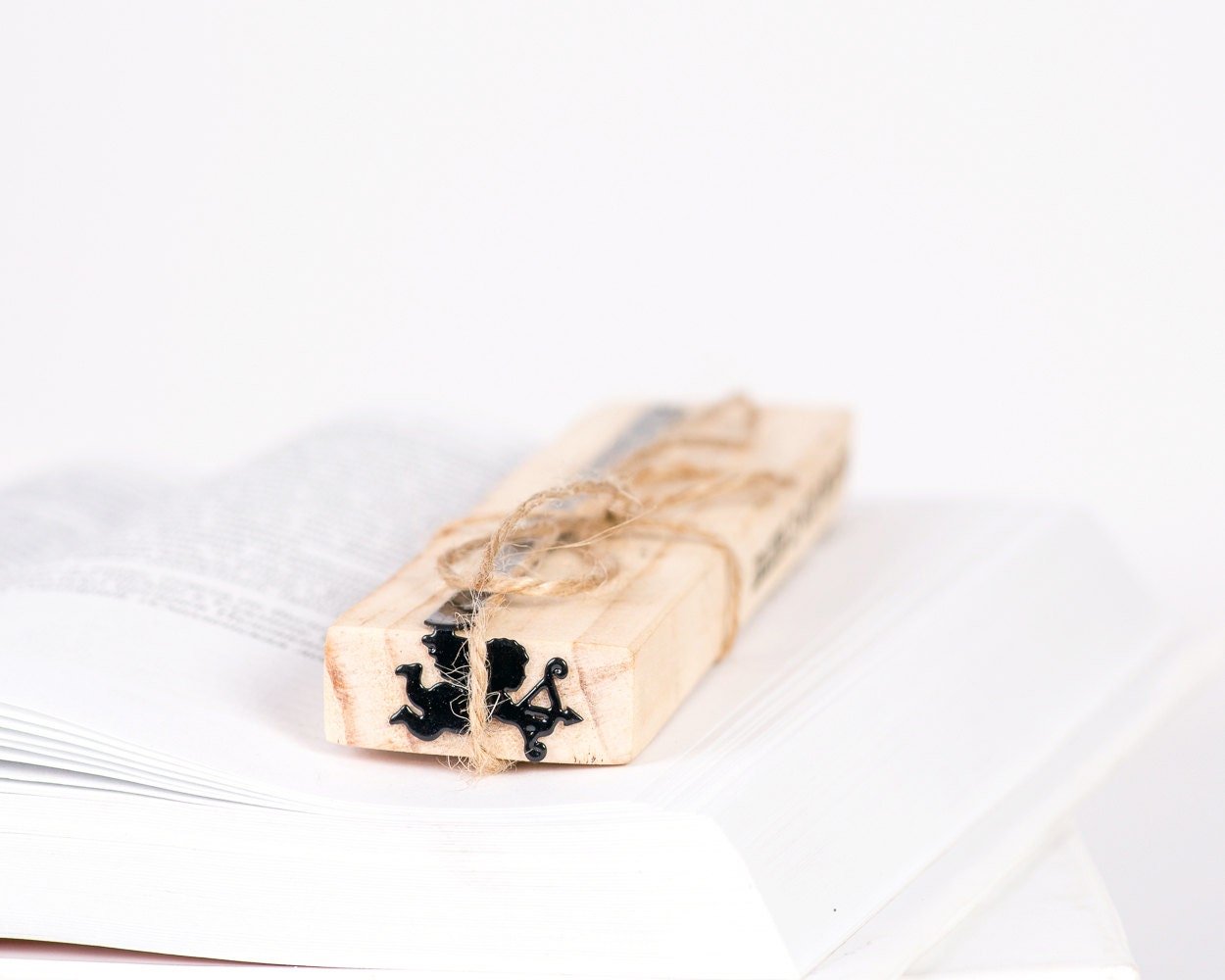 Cupid metal bookmark packed with kraft paper and twine as a gift