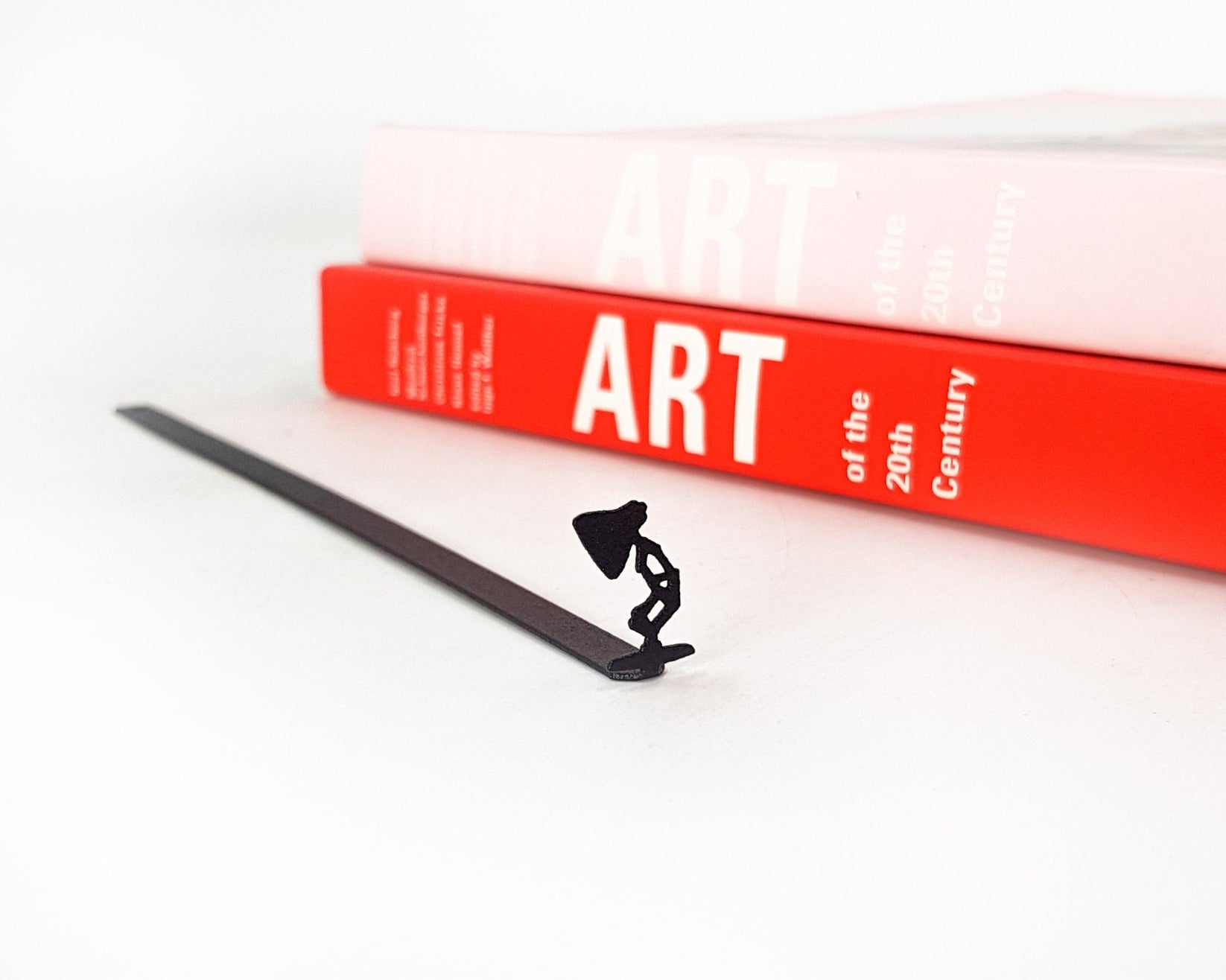 Desk Lamp metal bookmark against a coloured backdrop