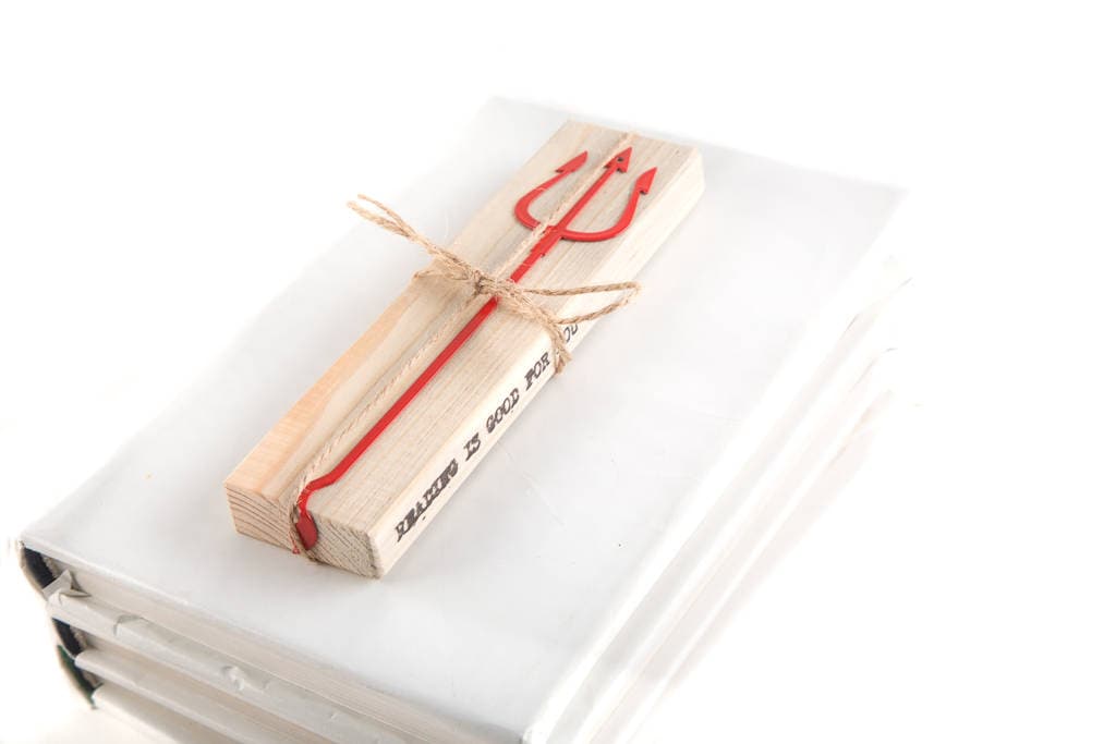 Devil's Trident metal bookmark with the engraved wooden gift block it ships with