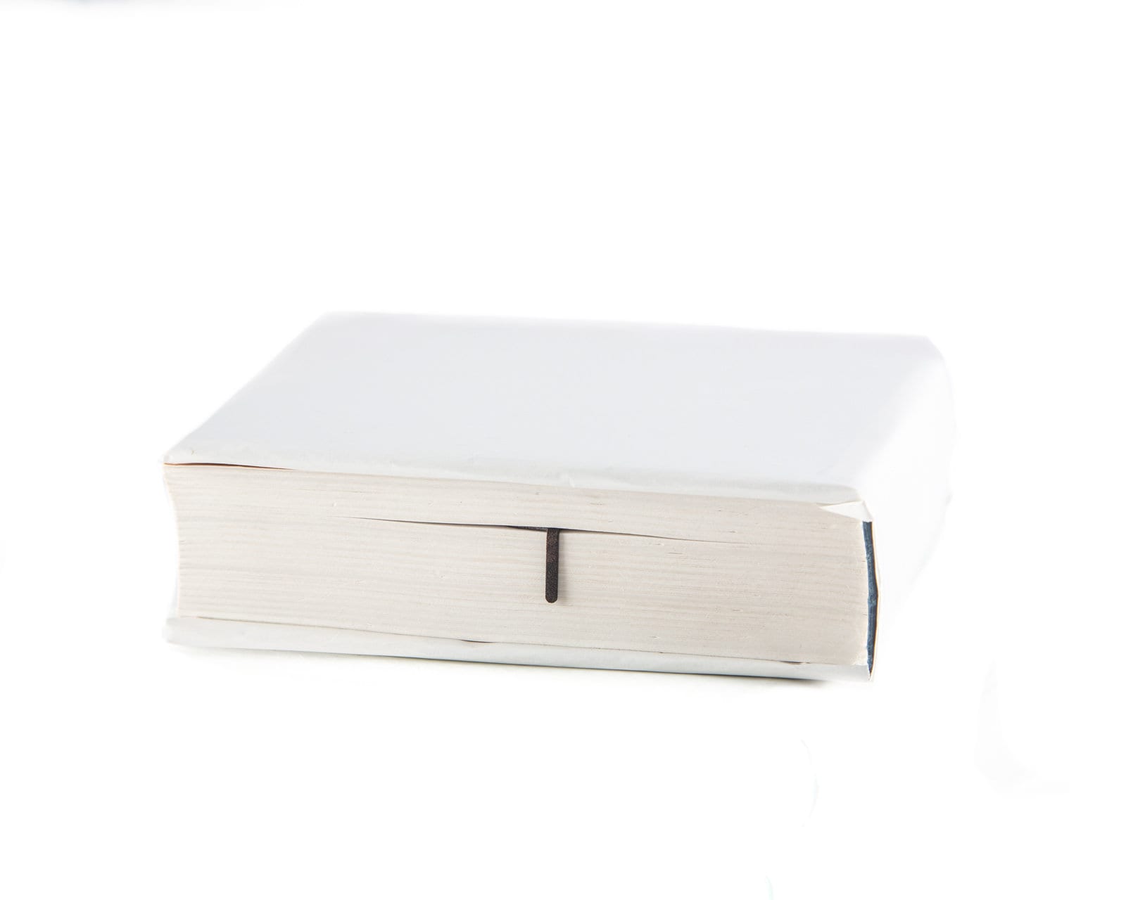 Do It metal bookmark marking a place in a closed book