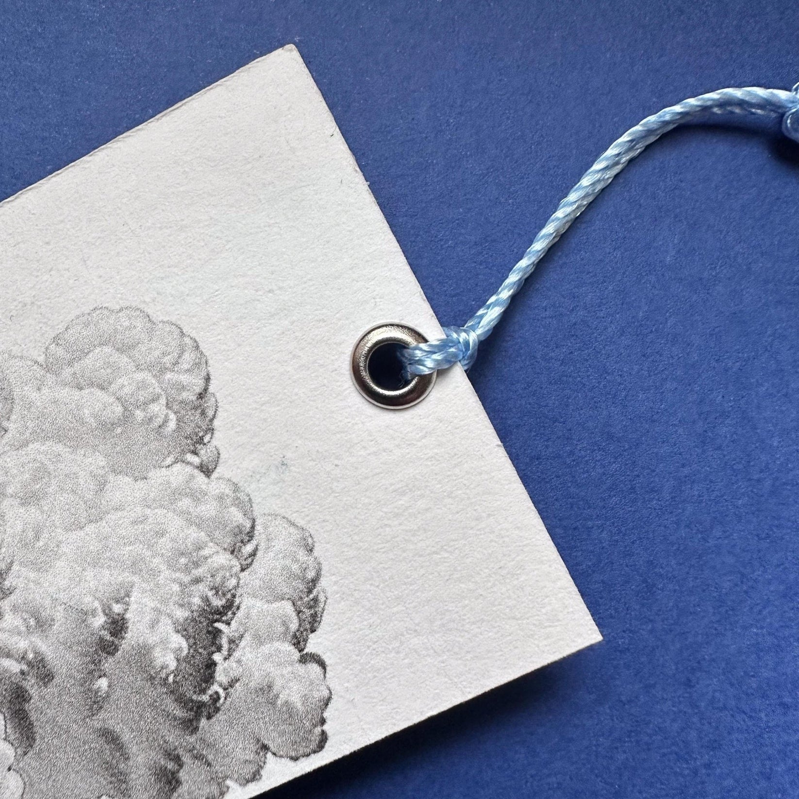 Dreamer metal bookmark shot on a coloured surface, view 6