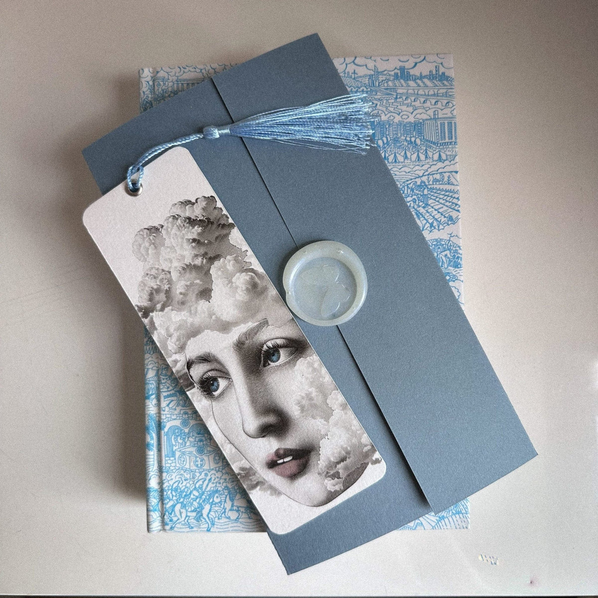 Dreamer metal bookmark shot on a coloured surface