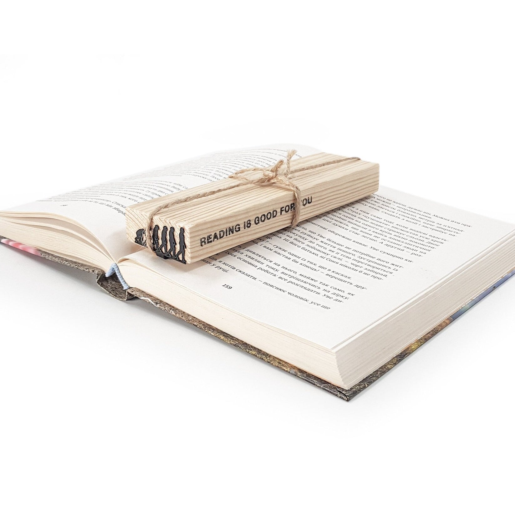 Evolution metal bookmark shown with its wooden gift block