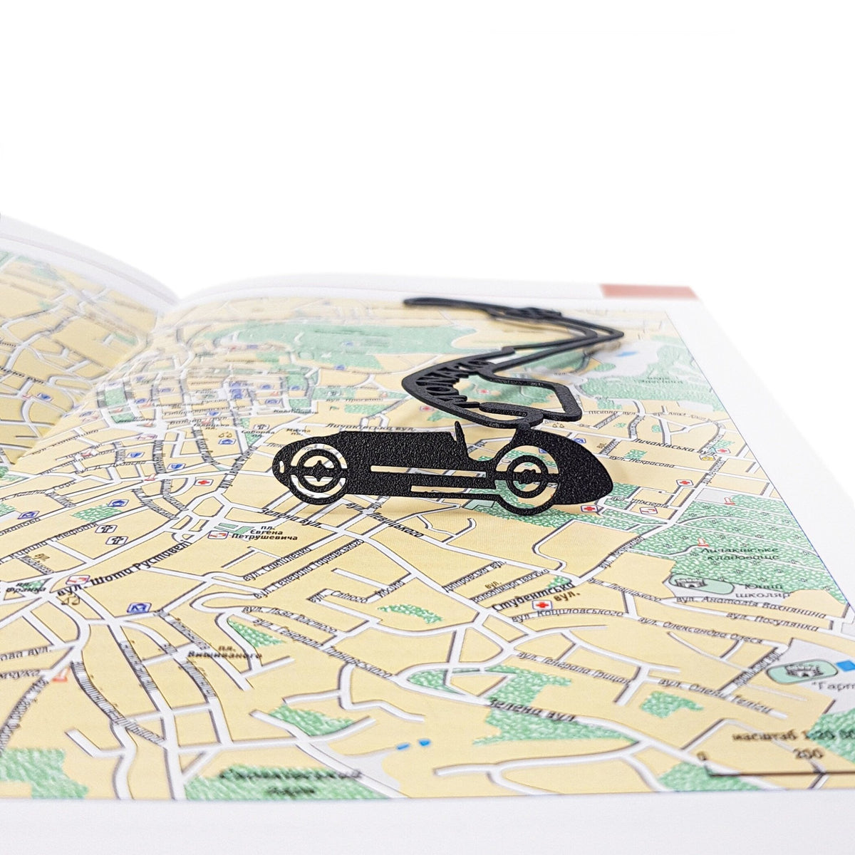 F1 Monaco Race Car metal bookmark shot on a coloured surface