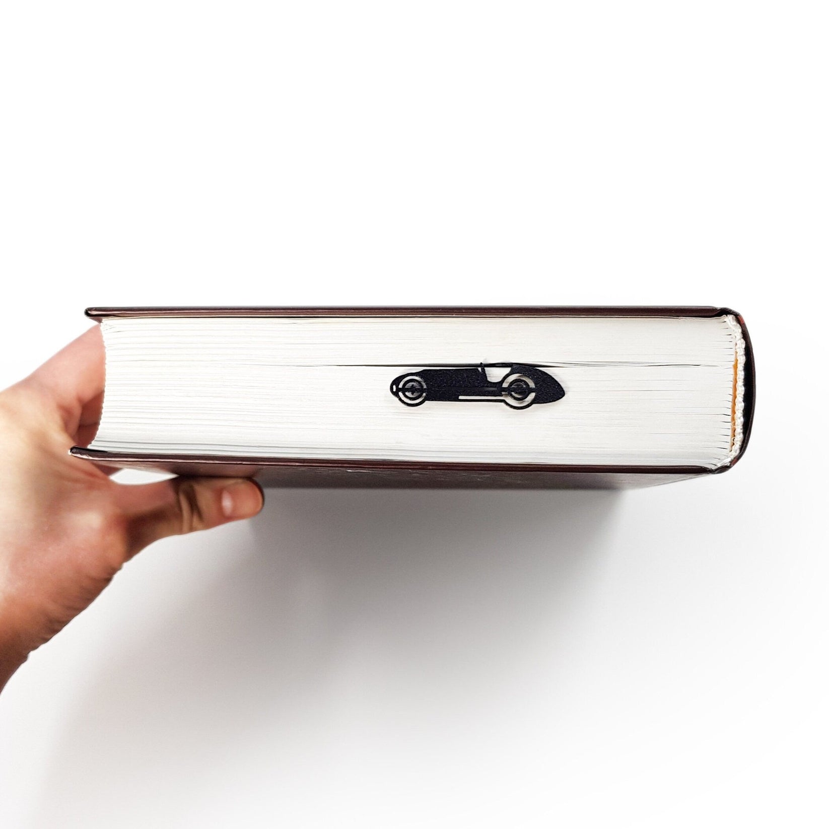F1 Monaco Race Car metal bookmark seen from the edge of a closed book
