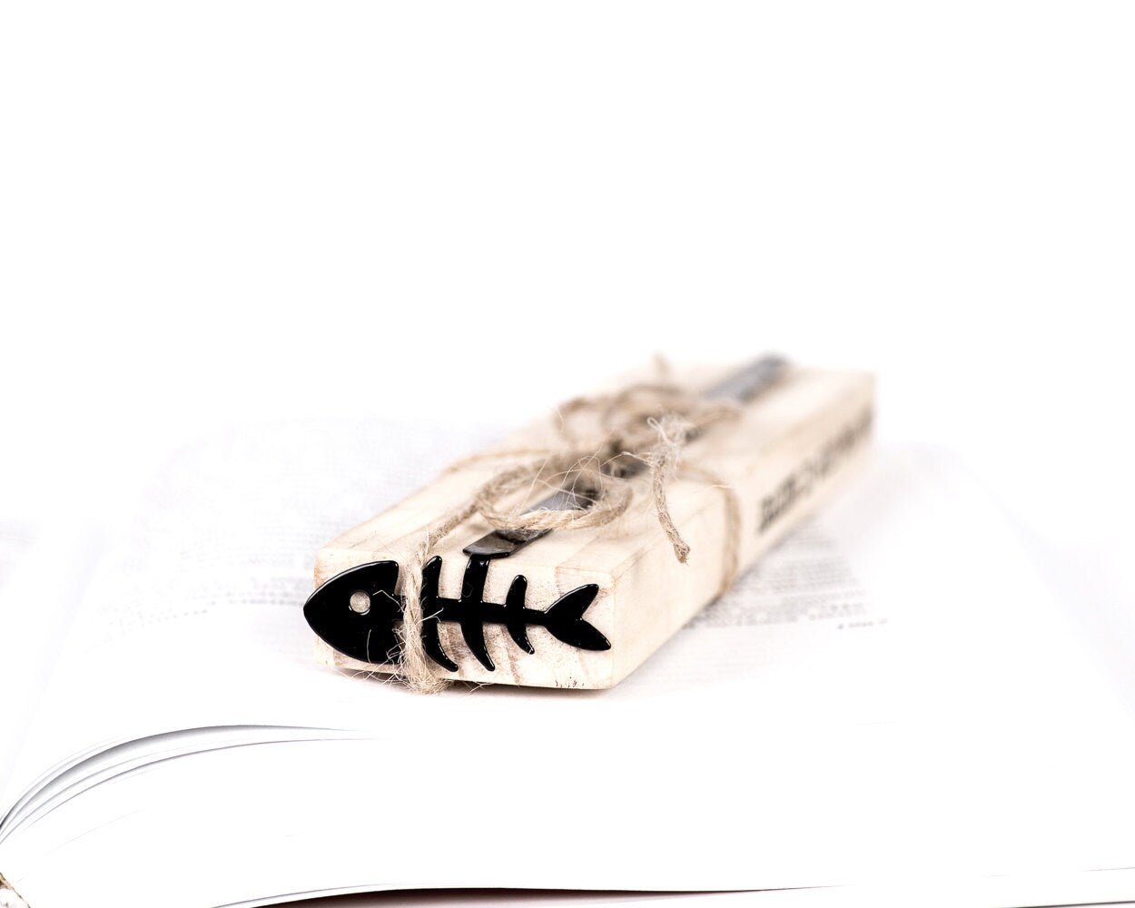 Fishbone metal bookmark with the engraved wooden gift block it ships with