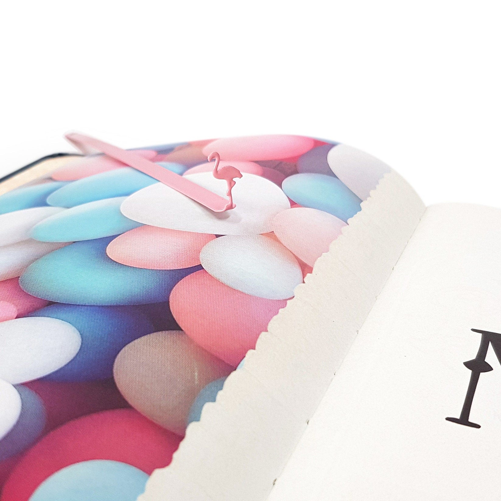 Flamingo metal bookmark in red against a coloured backdrop