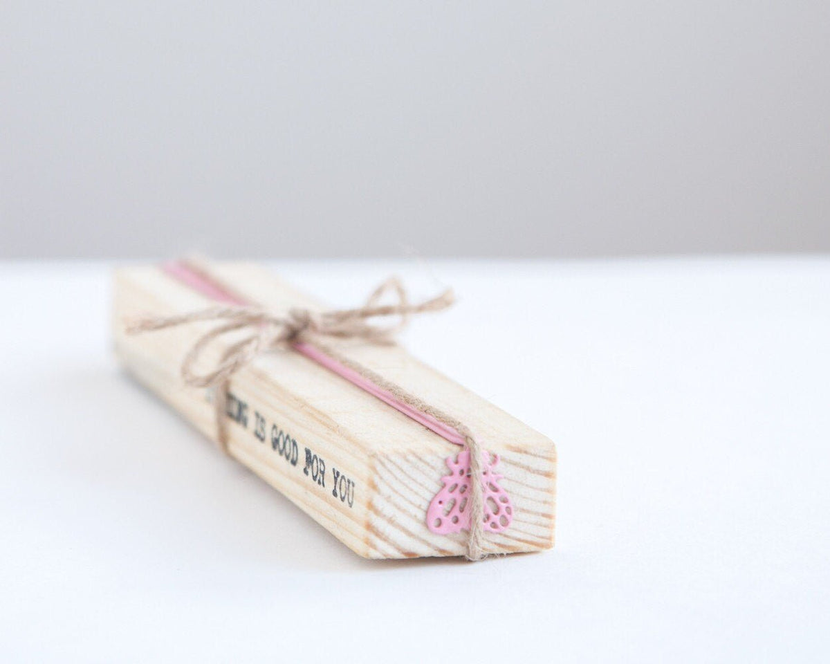Fly metal bookmark with the engraved wooden gift block it ships with