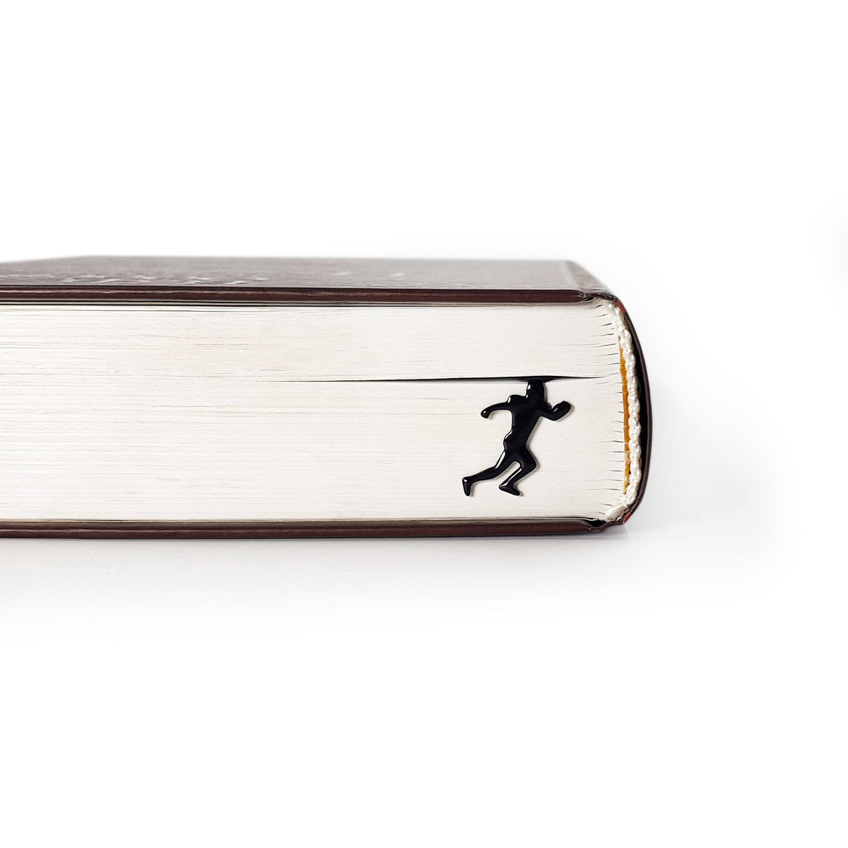 Football Player metal bookmark seen from the edge of a closed book