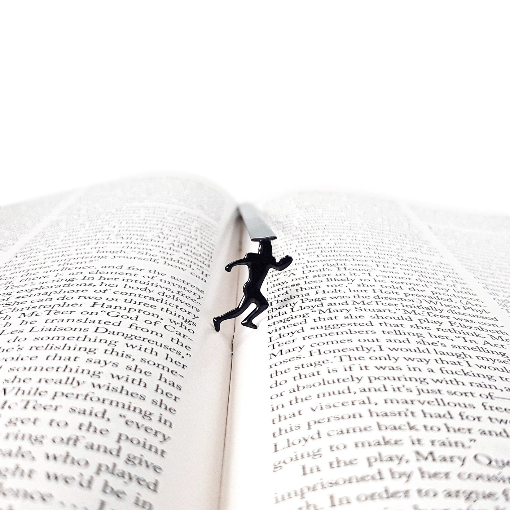 Football Player metal bookmark marking a page in an open book
