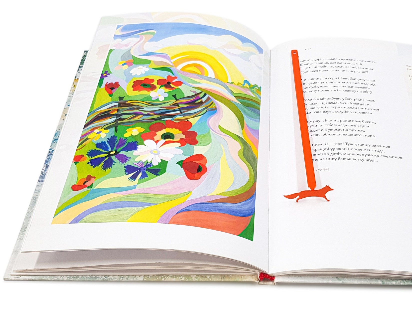 Fox on the Run metal bookmark on an illustrated page