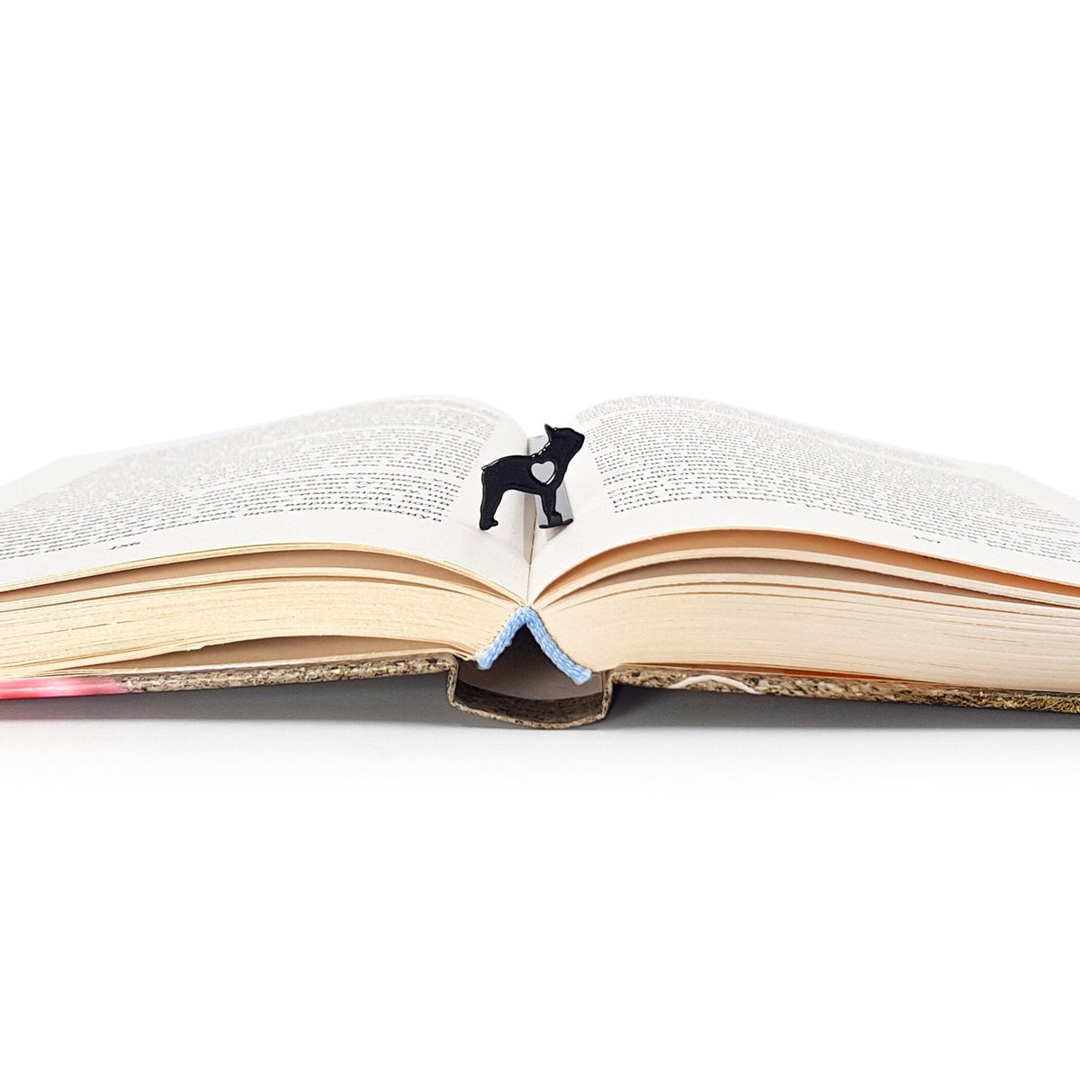 French Bulldog Love metal bookmark marking a page in an open book