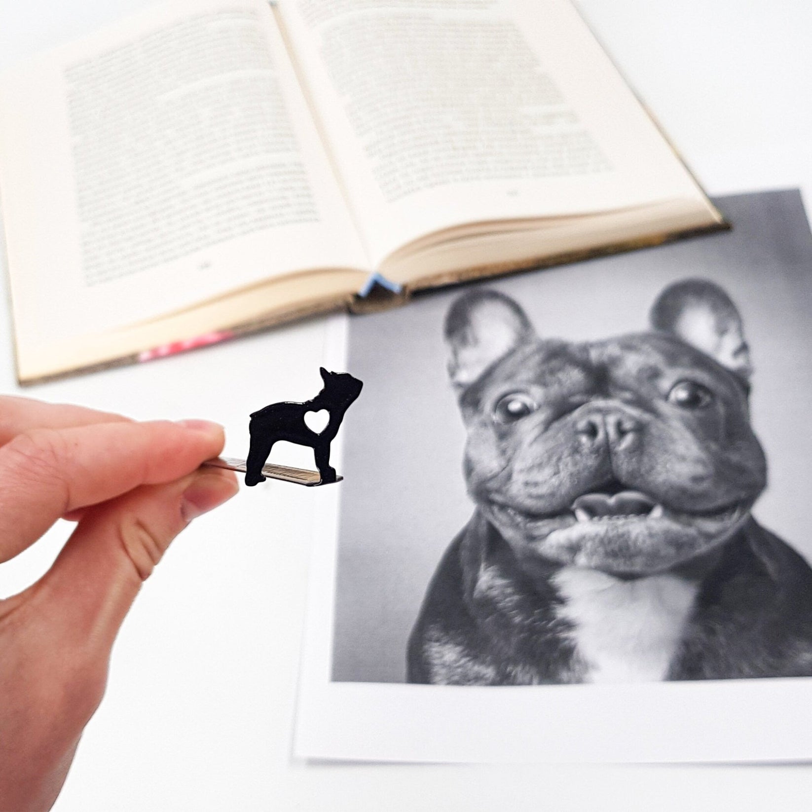 French Bulldog Love metal bookmark held in a hand to show its size
