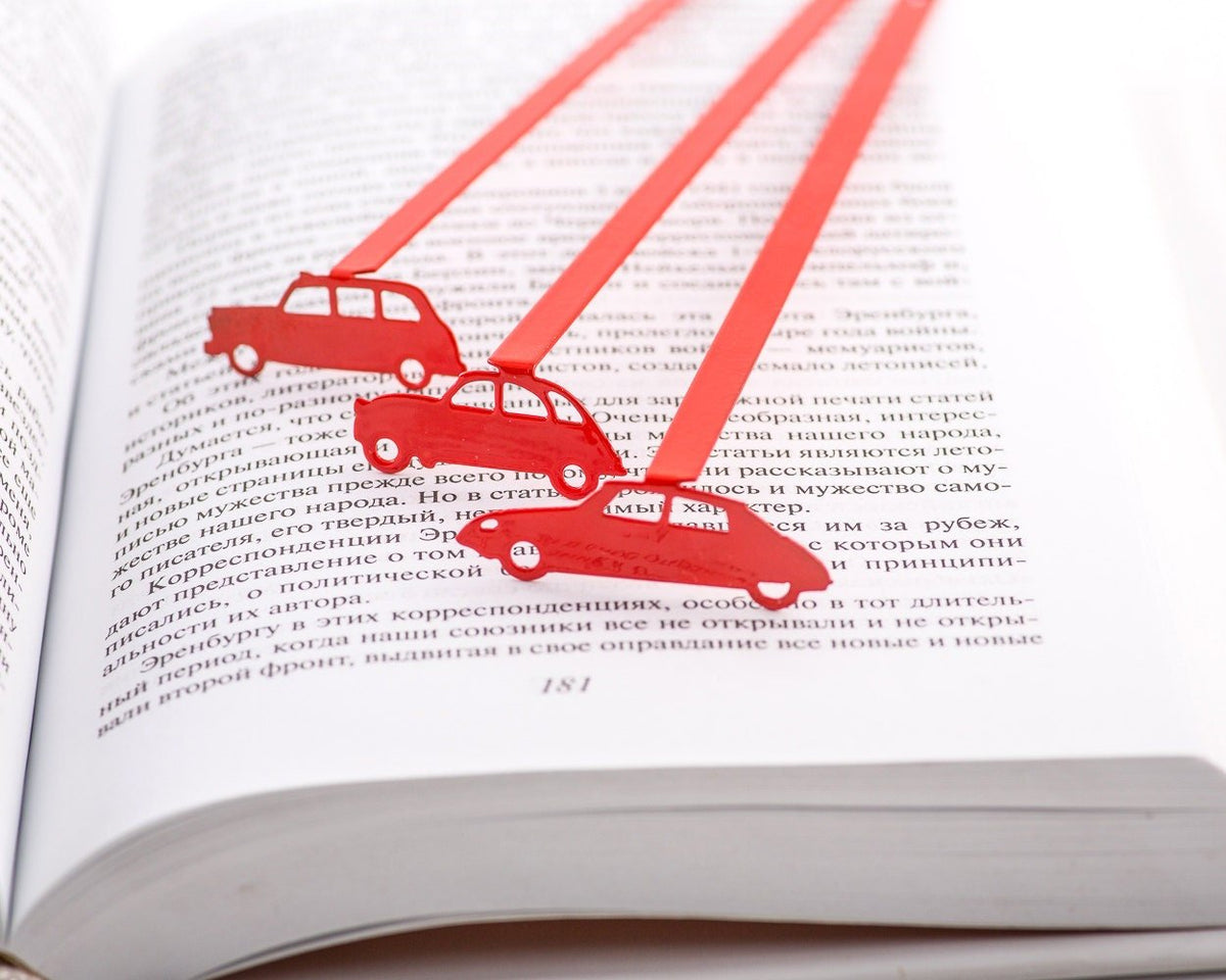 French Car metal bookmark in red shown together with other bookmarks from the range