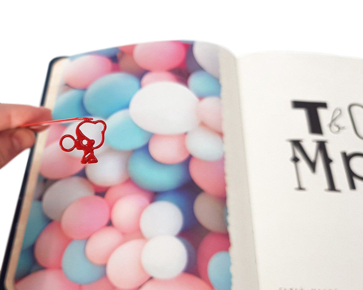 Girl with a Bubble Gum metal bookmark on a coloured background