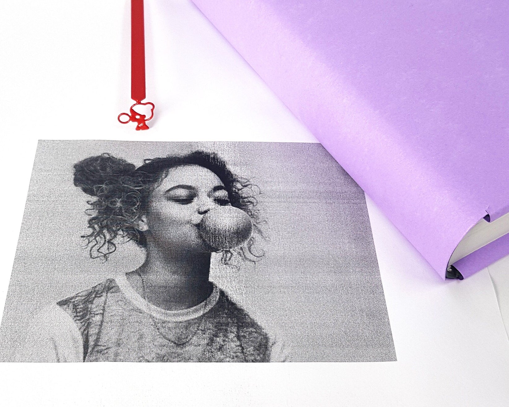 Girl with a Bubble Gum metal bookmark on an illustrated page