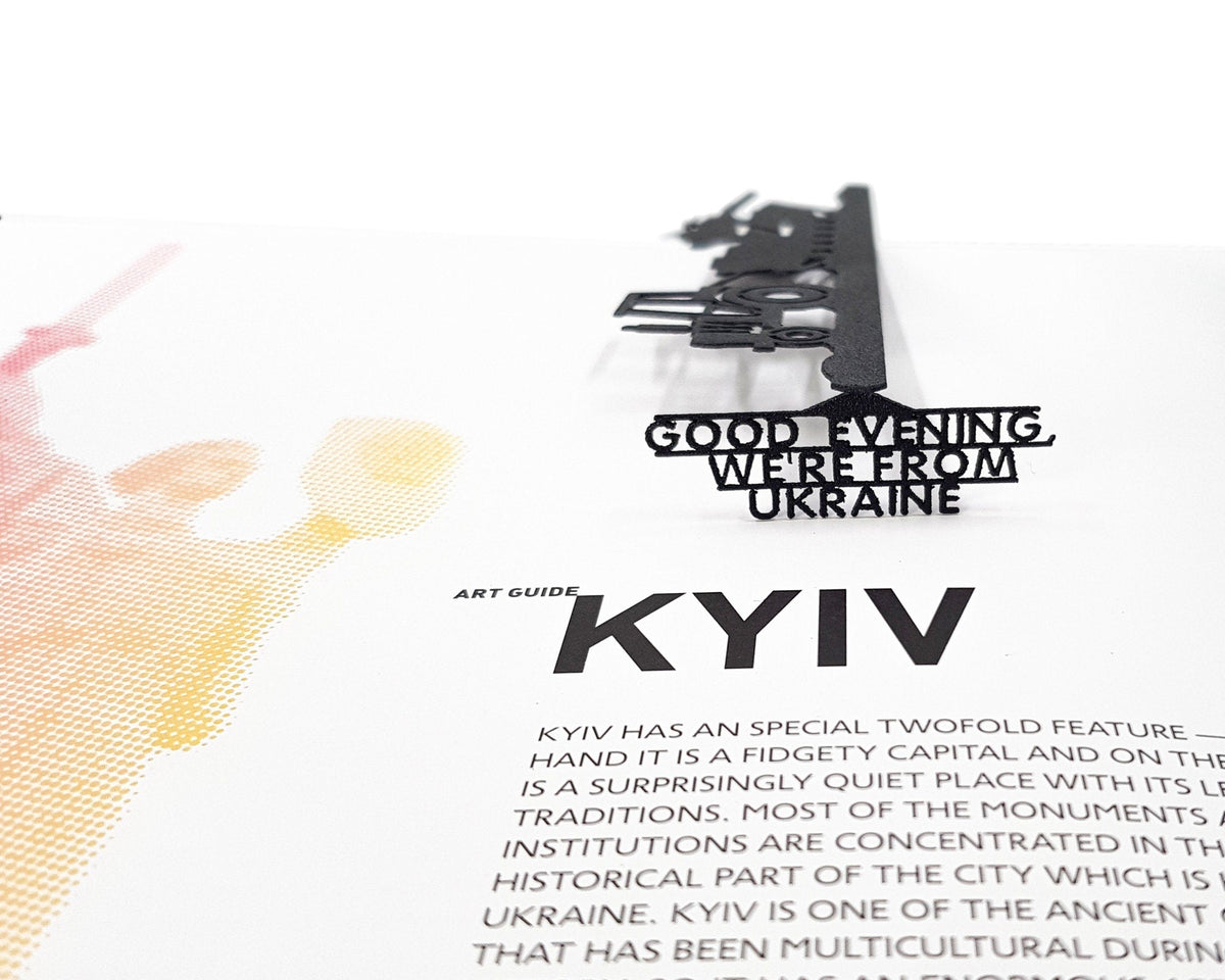 Good Evening We Are from Ukraine metal bookmark placed on a colour illustration