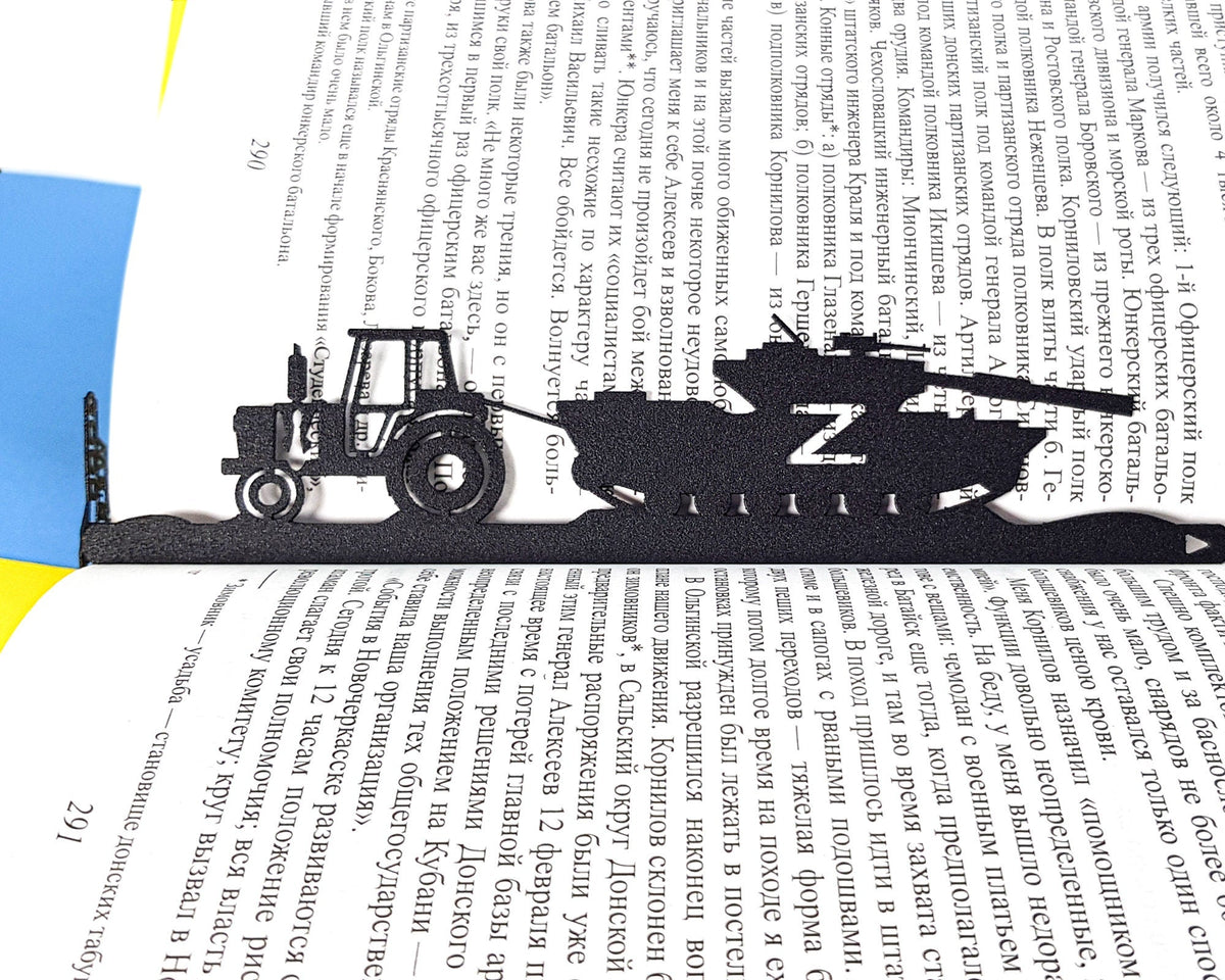 Good Evening We Are from Ukraine metal bookmark resting on the pages of an open book
