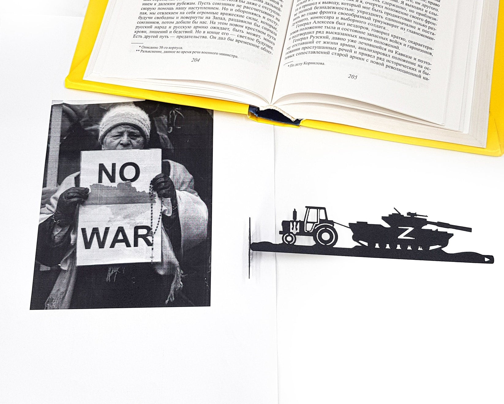 Good Evening We Are from Ukraine metal bookmark marking a page in an illustrated book, view 4