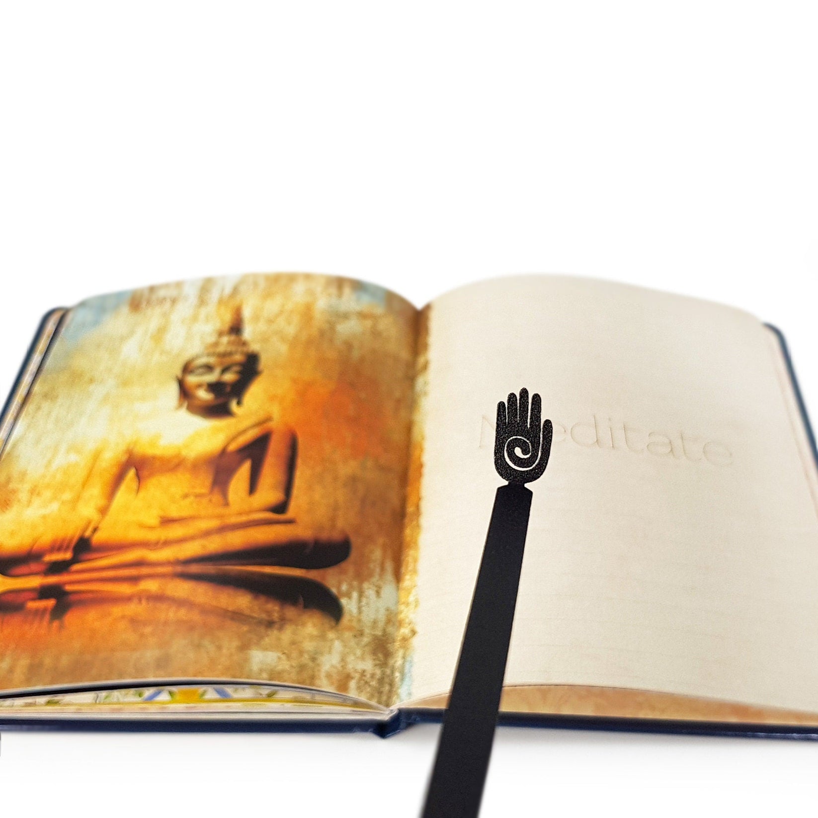 Healing Hand metal bookmark marking a page in an illustrated book