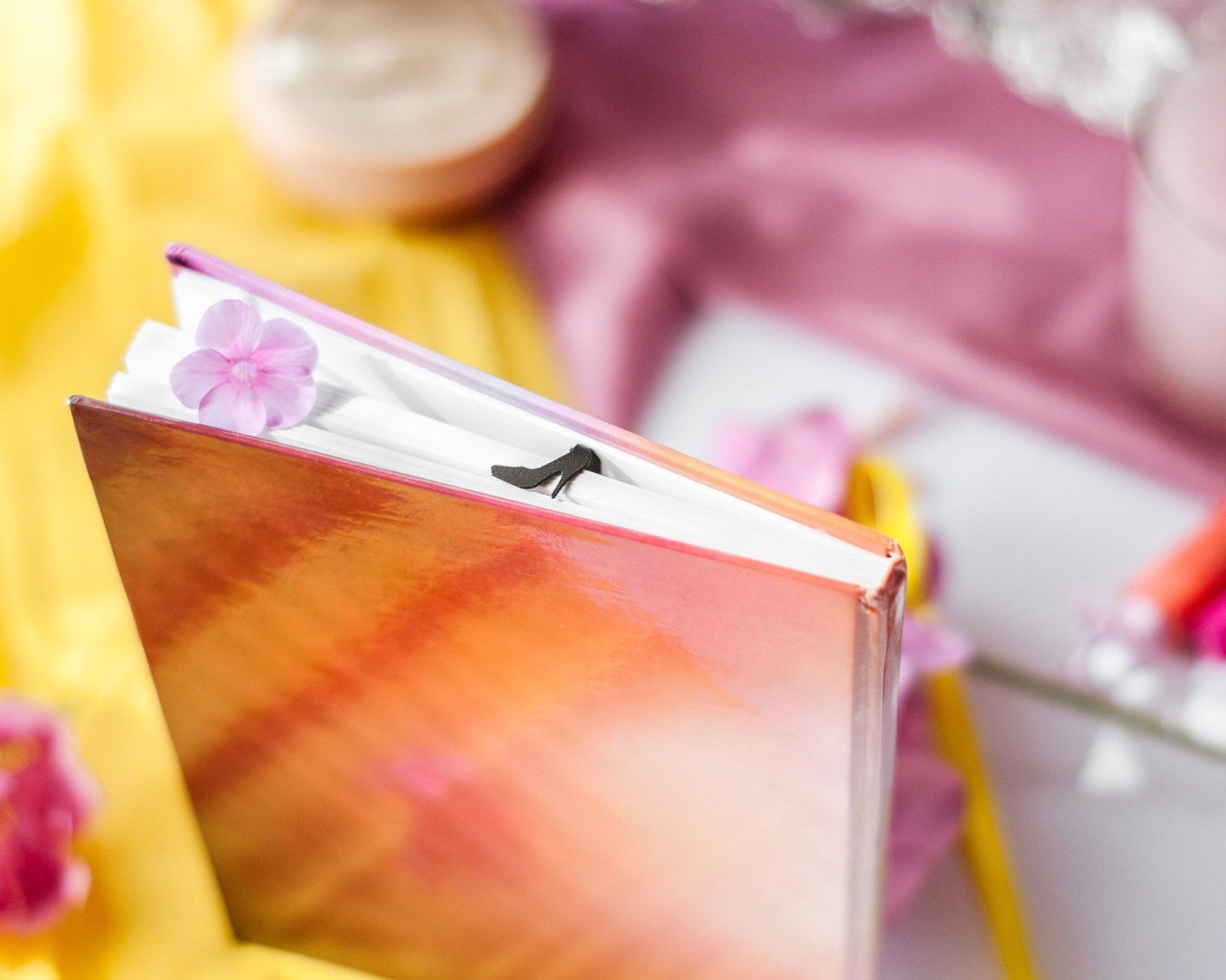 High Heel Shoe metal bookmark on a coloured background