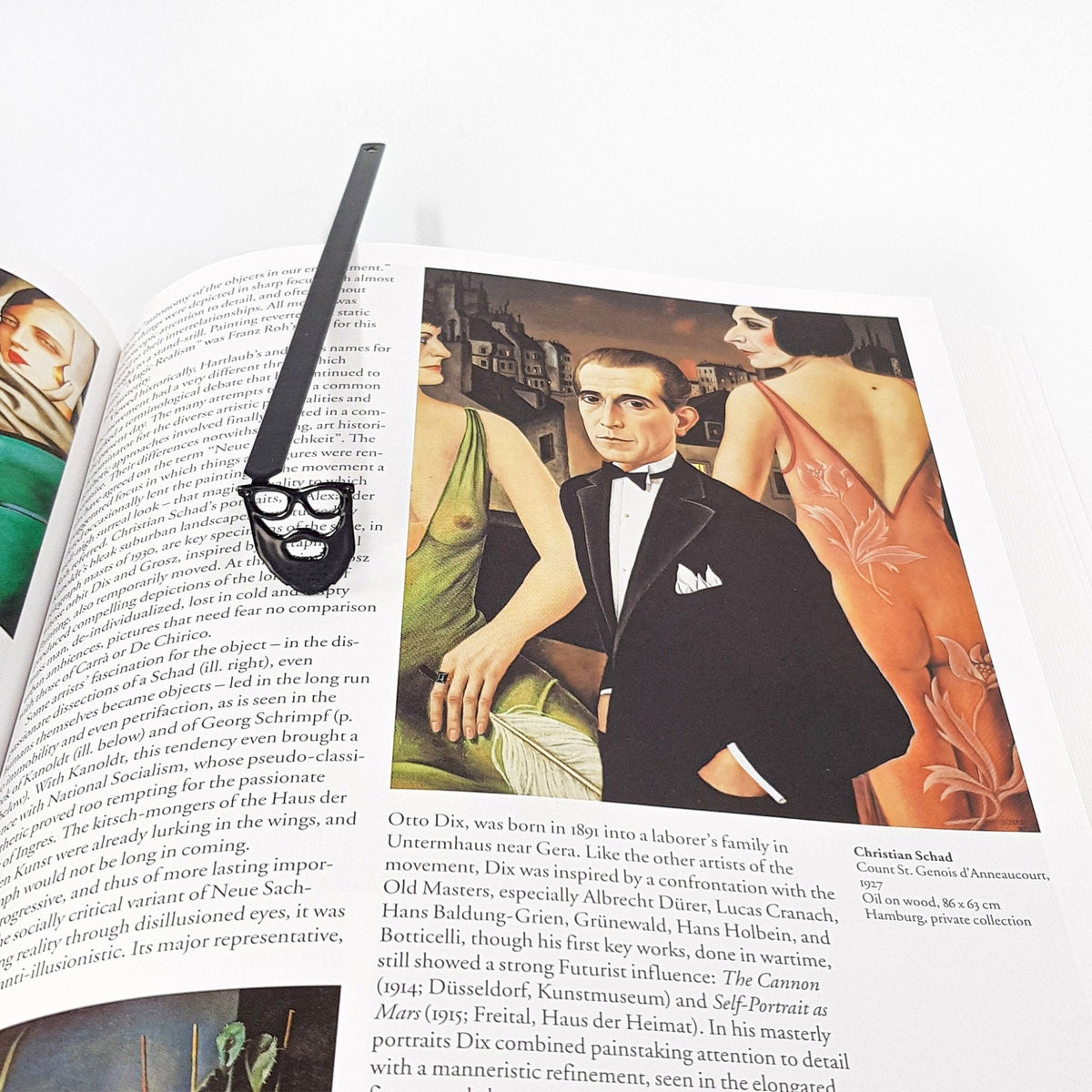 Hipster metal bookmark on an illustrated page