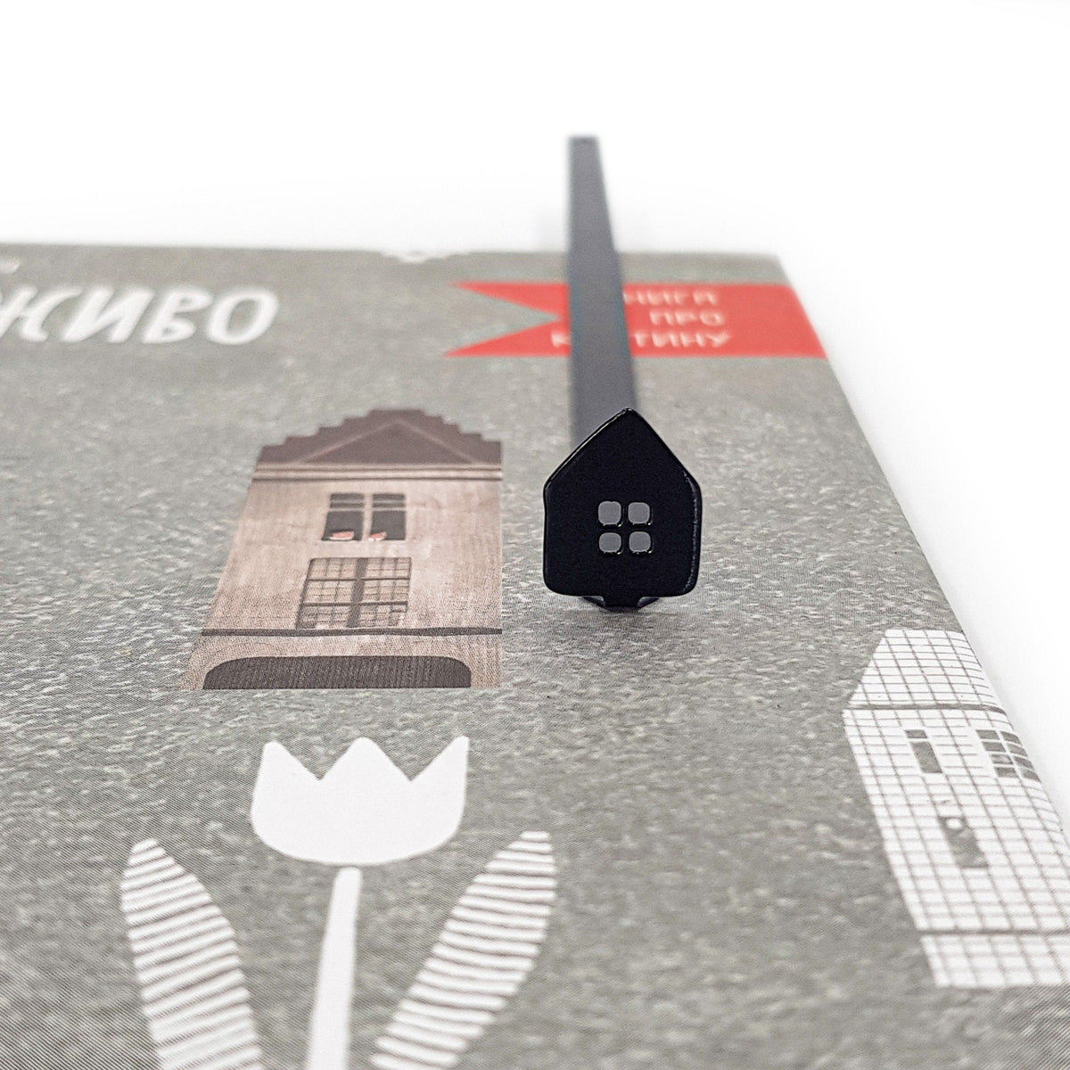 Home Sweet Home metal bookmark on an illustrated page