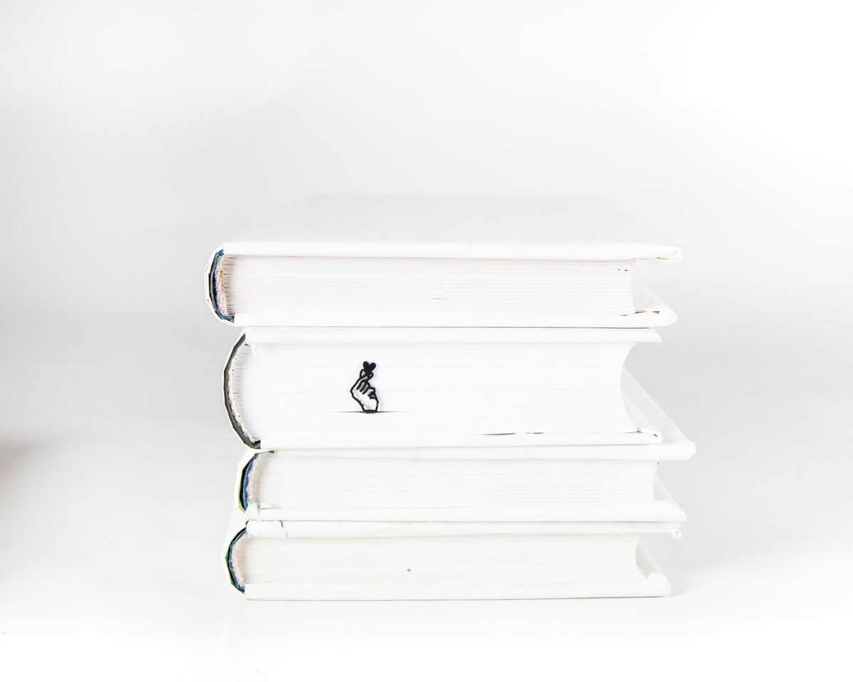 I Am Giving You My Heart metal bookmark shown with a stack of books