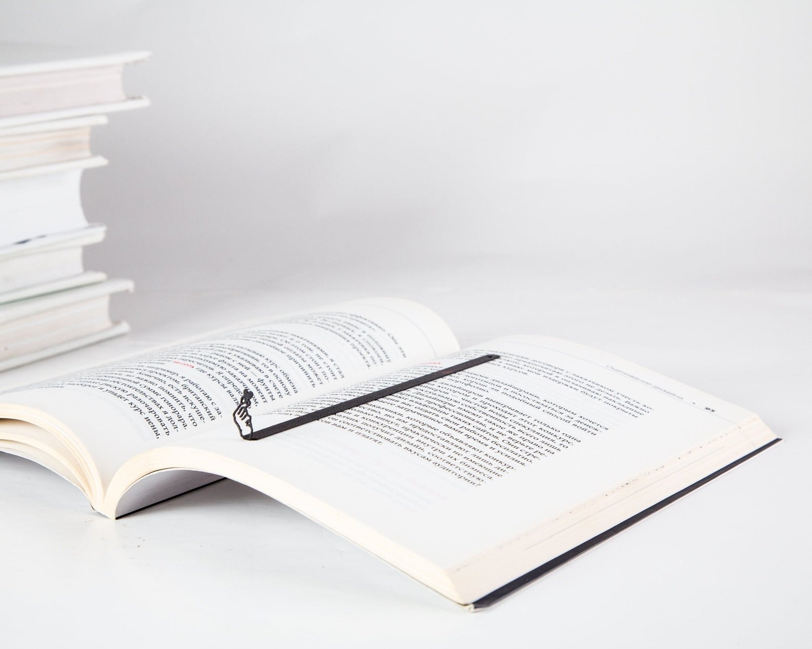 I Am Giving You My Heart metal bookmark resting on the pages of an open book