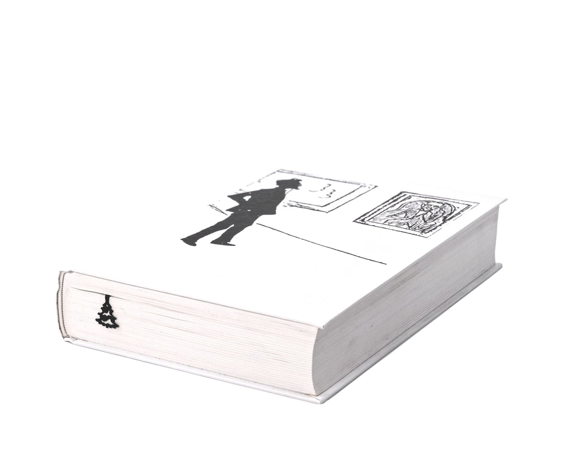 Winter Sleigh Ride metal bookmark seen from the edge of a closed book
