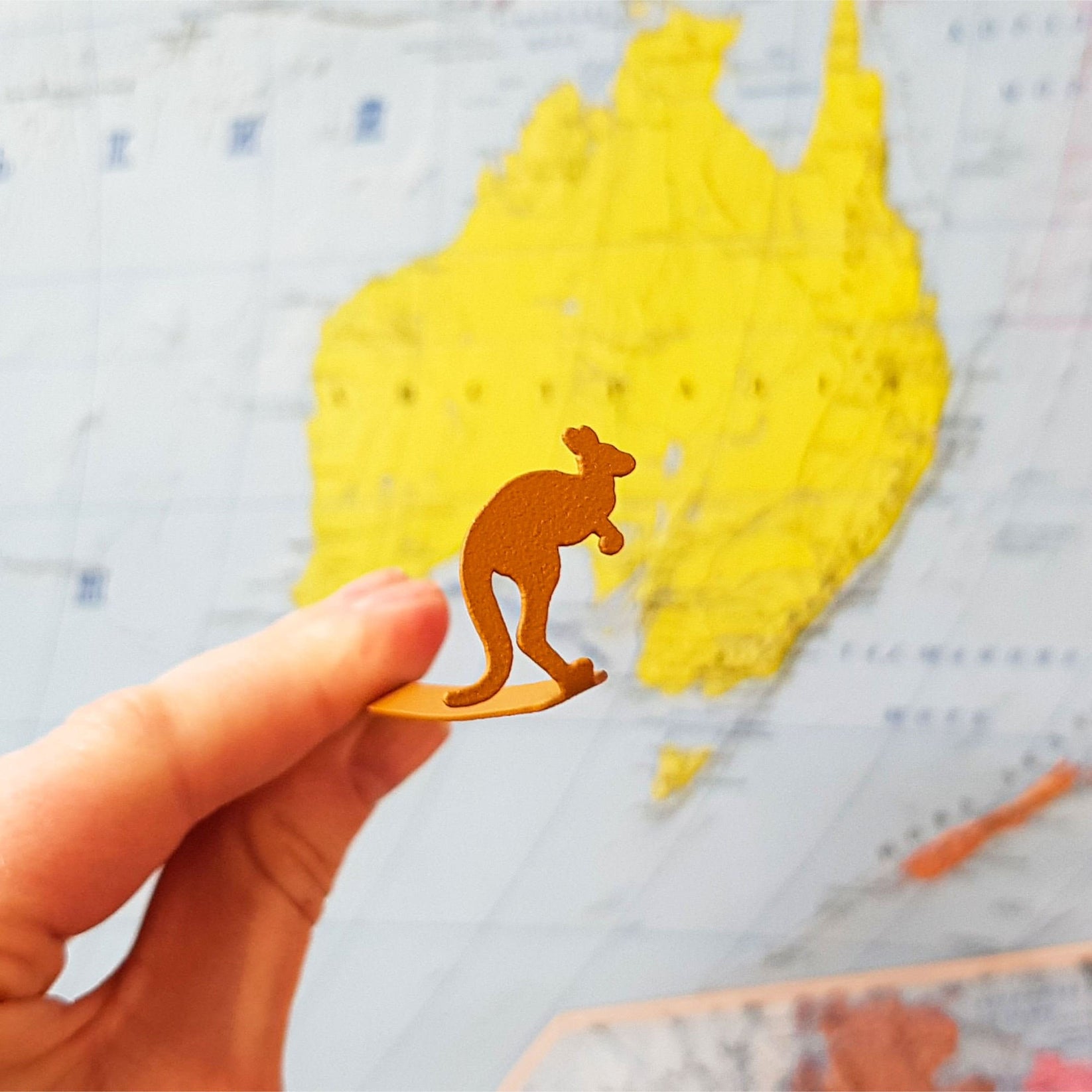 Kangaroo metal bookmark in gold on a coloured background