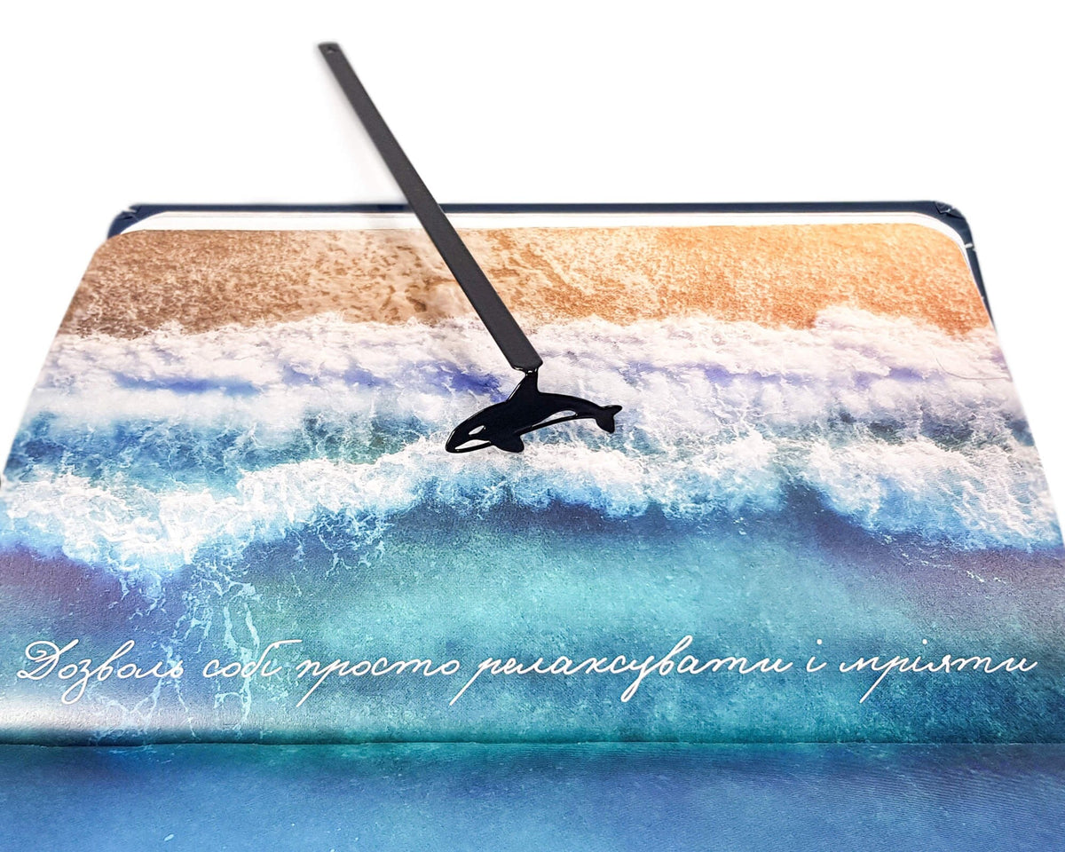 Killer Whale Orca metal bookmark on an illustrated page