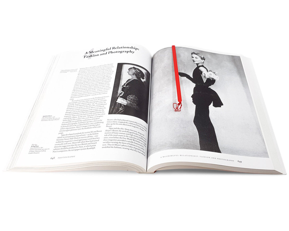 Lady in Red metal bookmark in red marking a page in an illustrated book, view 4