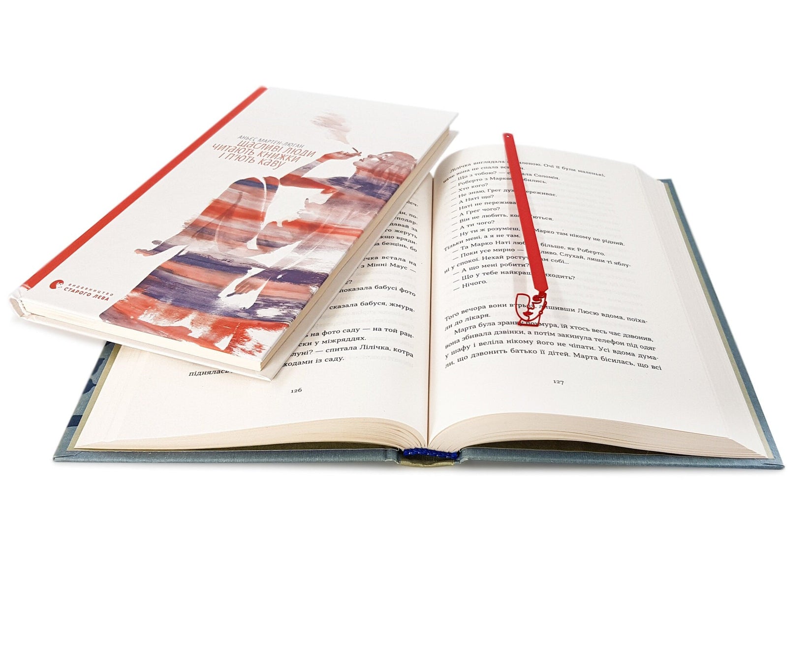 Lady in Red metal bookmark in red on an illustrated page