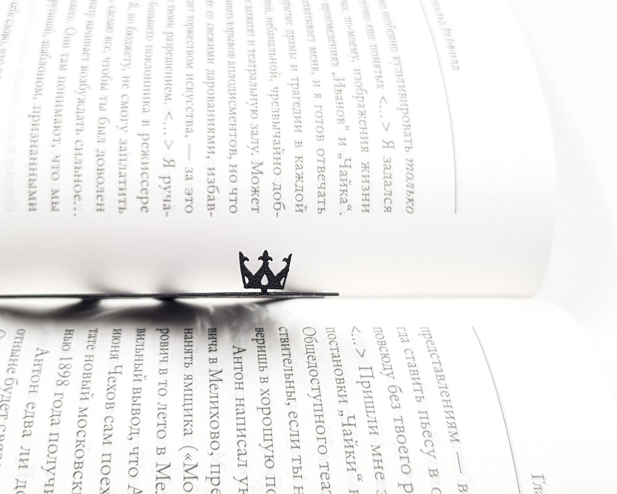 Lion, The King of Animals metal bookmark marking a page in an open book