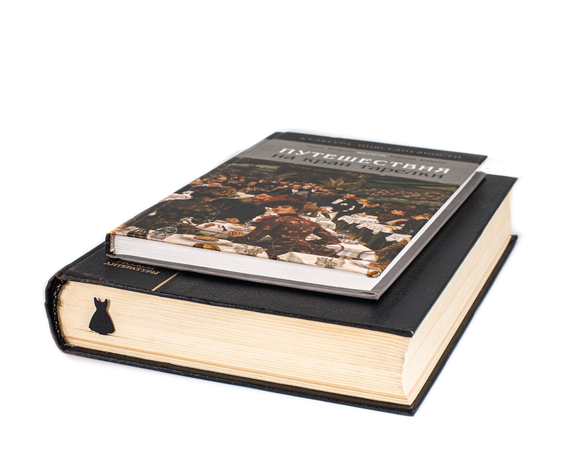 Little Black Dress metal bookmark seen from the edge of a closed book
